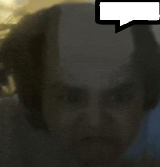 a blurry picture of a person with a speech bubble above them