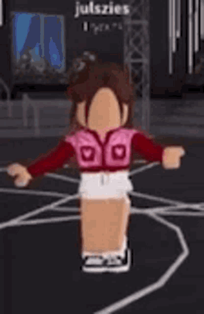 a girl in a pink vest is dancing on a basketball court .