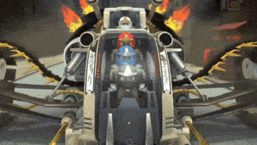 a ninjago character is sitting in the cockpit of a toy vehicle