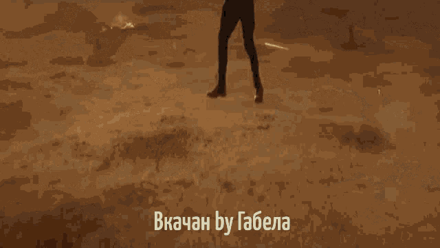 a man is standing in the desert with the words " bkachan by gabela " on the bottom