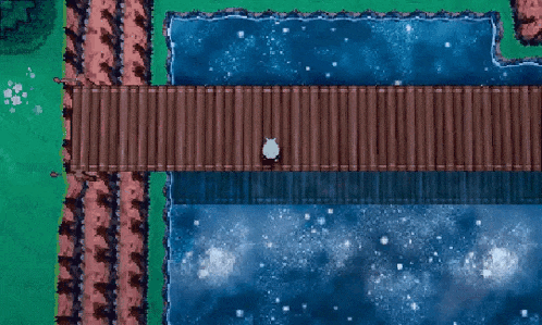 an aerial view of a wooden bridge over a body of water surrounded by trees