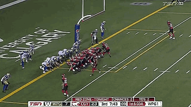 a football game is being played in front of a pepsi sign