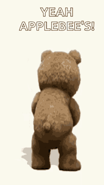 a teddy bear is holding a shaker and saying `` yeah applebee 's ! ''