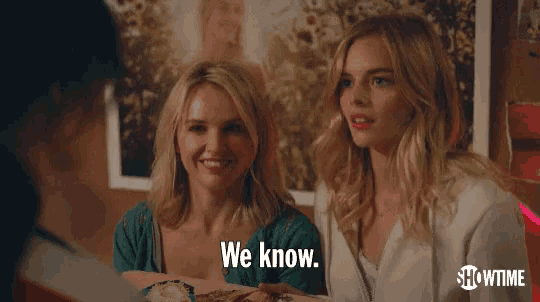 two women are sitting at a table and one of them says we know .
