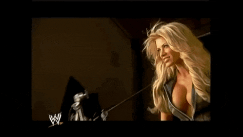 a blonde woman is smiling in front of a w logo