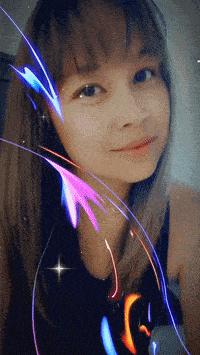 a woman 's face is surrounded by colorful lights and a star