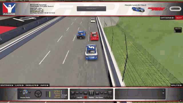 a racing game is being played with a chevrolet camaro in the background