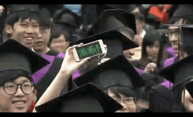 a group of graduates are taking a picture of themselves with a cell phone
