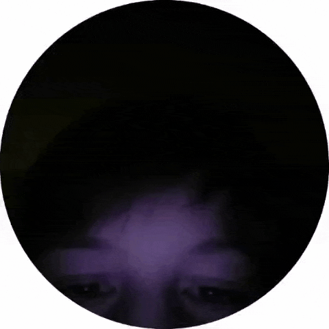 a close up of a person 's face in a circle