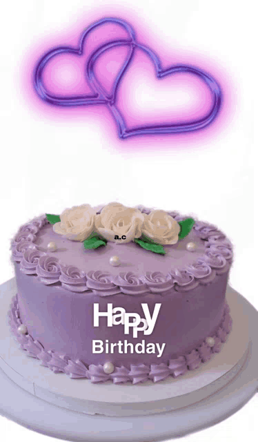 a purple birthday cake with roses and pearls says happy birthday