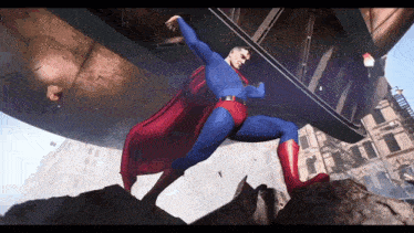 a man in a superman costume with a red cape