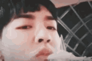 a close up of a person eating food with a fork and spoon .