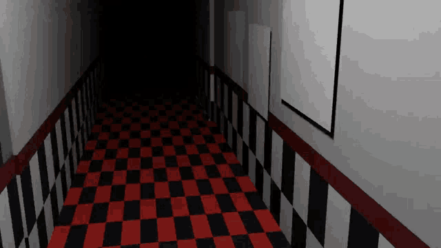 a hallway with red and black checkered flooring