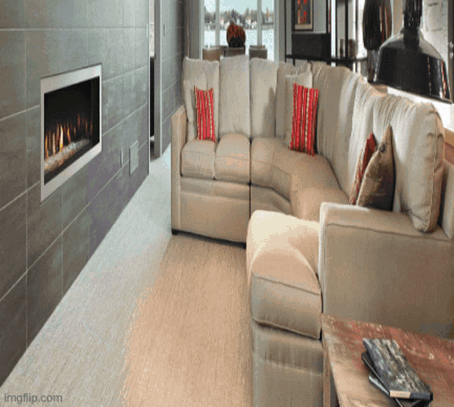 a living room with a sectional couch and a fireplace with imgflip.com in the corner