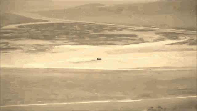 a large explosion in the middle of a desert .