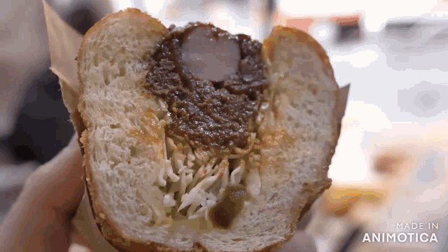 a close up of a sandwich with the words made in animatica written on the bottom