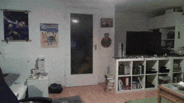 a living room with a poster on the wall that says ' zdf fernsehen '