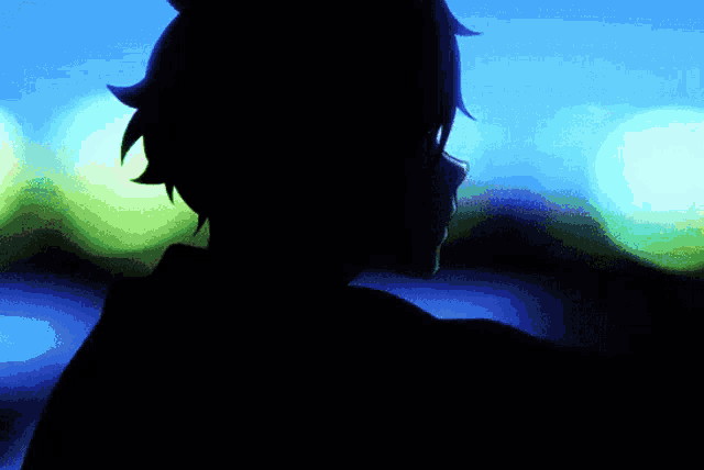 a silhouette of a person against a blue sky
