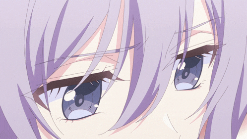 a close up of a person 's eyes with a purple hair color
