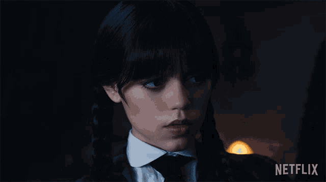 a girl in a school uniform is asking what is it exactly