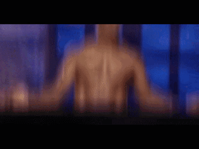 a blurry picture of a person behind a blue curtain