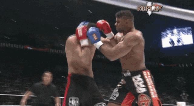 a man in a boxing ring with the word replay on the bottom
