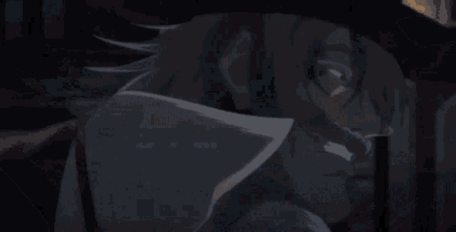 a person is holding a sword and a blue light is coming out of it .