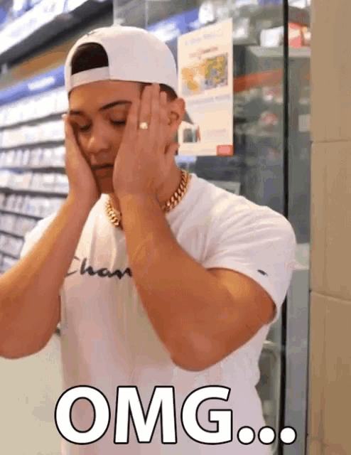 a man wearing a white hat and a white shirt with the word omg written on it