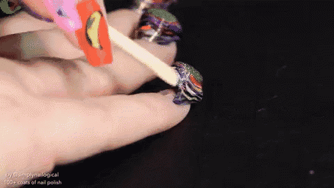 a close up of a person applying nail polish with the words 100+ coats of nail polish on the bottom