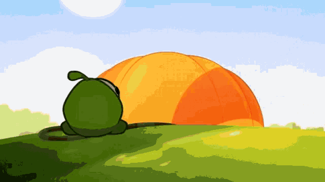 a cartoon frog is laying on a grassy hill next to an orange dome