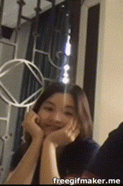 a woman 's face is shown in a free gif maker app