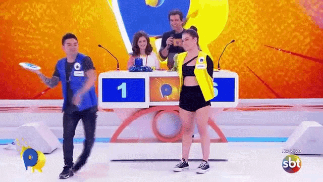 a group of people are playing a game on a television show called sbt .