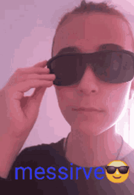 a person wearing sunglasses with the word messirve in blue