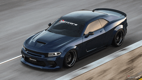 a blue dodge charger with a hotcars sticker on the windshield