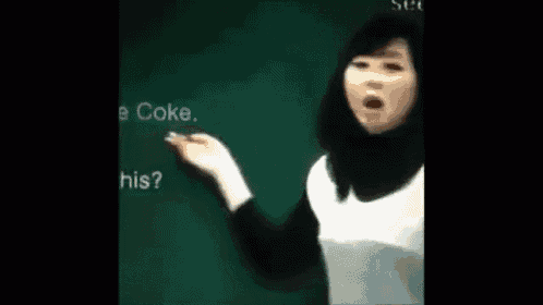 a woman is writing on a blackboard that says coke s on it .