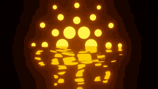 a bunch of yellow circles are floating in the dark