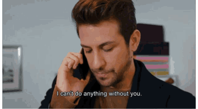 a man talking on a cell phone with the words i can 't do anything without you