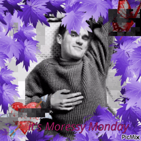 a man in a sweater is surrounded by purple leaves and the words it 's moressy monday