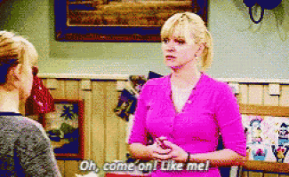 a woman in a pink shirt is talking to another woman and says oh come on like me