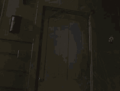 jason voorhees is wearing a hockey mask and standing in a dark room .