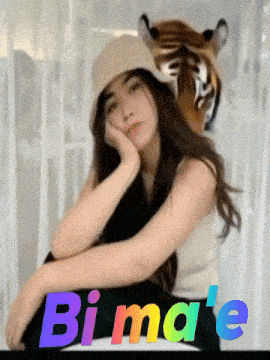 a woman wearing a hat with a tiger head behind her and the word bimale on the bottom right