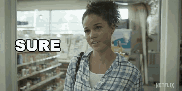 a woman in a plaid shirt is standing in a store with the word sure above her
