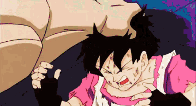 a girl in a pink shirt is being attacked by someone