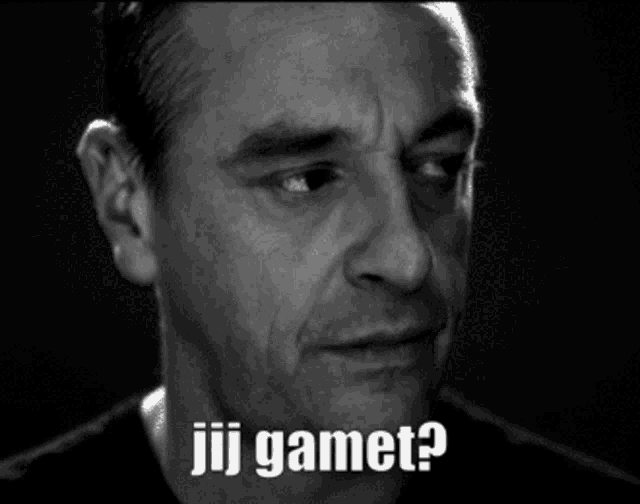 a black and white photo of a man with the words jij gamet written on his face