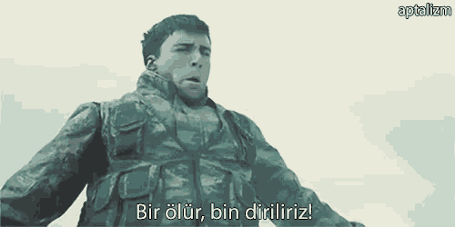a man in a military uniform is talking in a foreign language