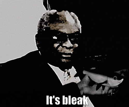 a black and white photo of a man holding a fish and the words it 's bleak below him