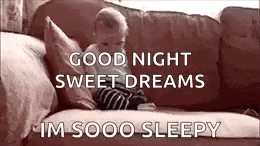 a baby is sitting on a couch with the words `` good night sweet dreams im sooo sleepy '' written on it .