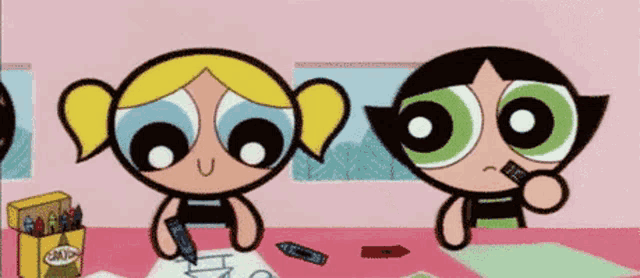 buttercup and bubbles from the powerpuff girls are sitting at a table drawing with crayons .