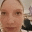 a close up of a woman 's face with a blurry background
