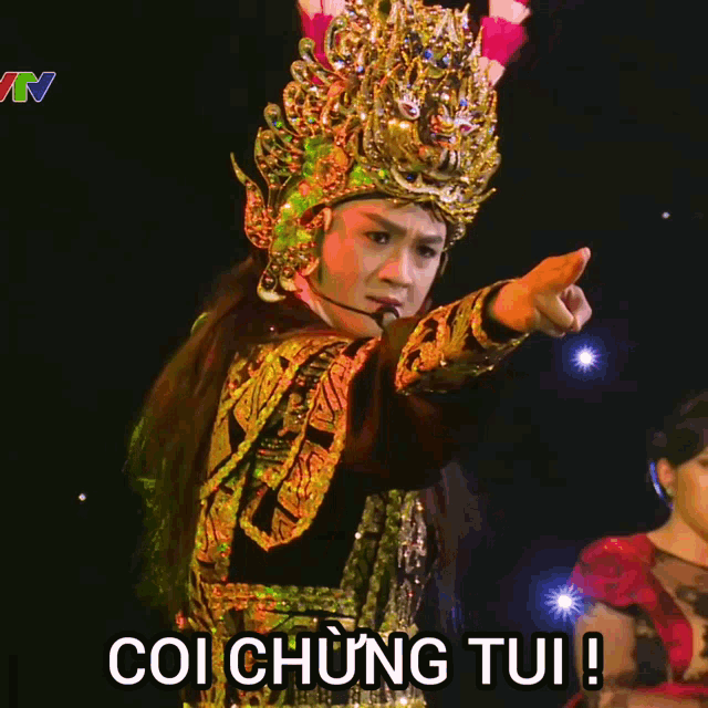 a man in a costume with the word coi chung tui on the bottom right